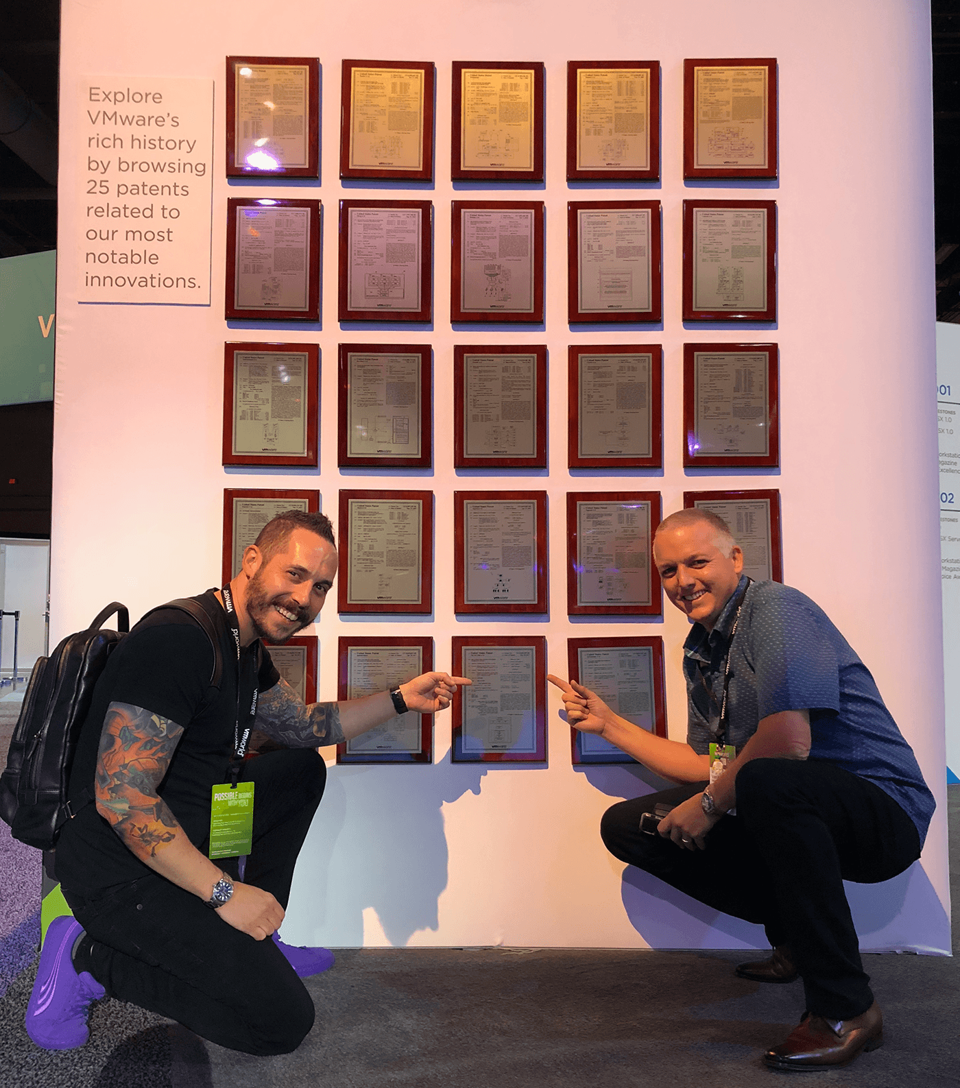 Picture of Dave and Mornay at VMworld 2018 in front of VMware's most notable Patents