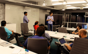 Engineers talking and discussing solutions around a table